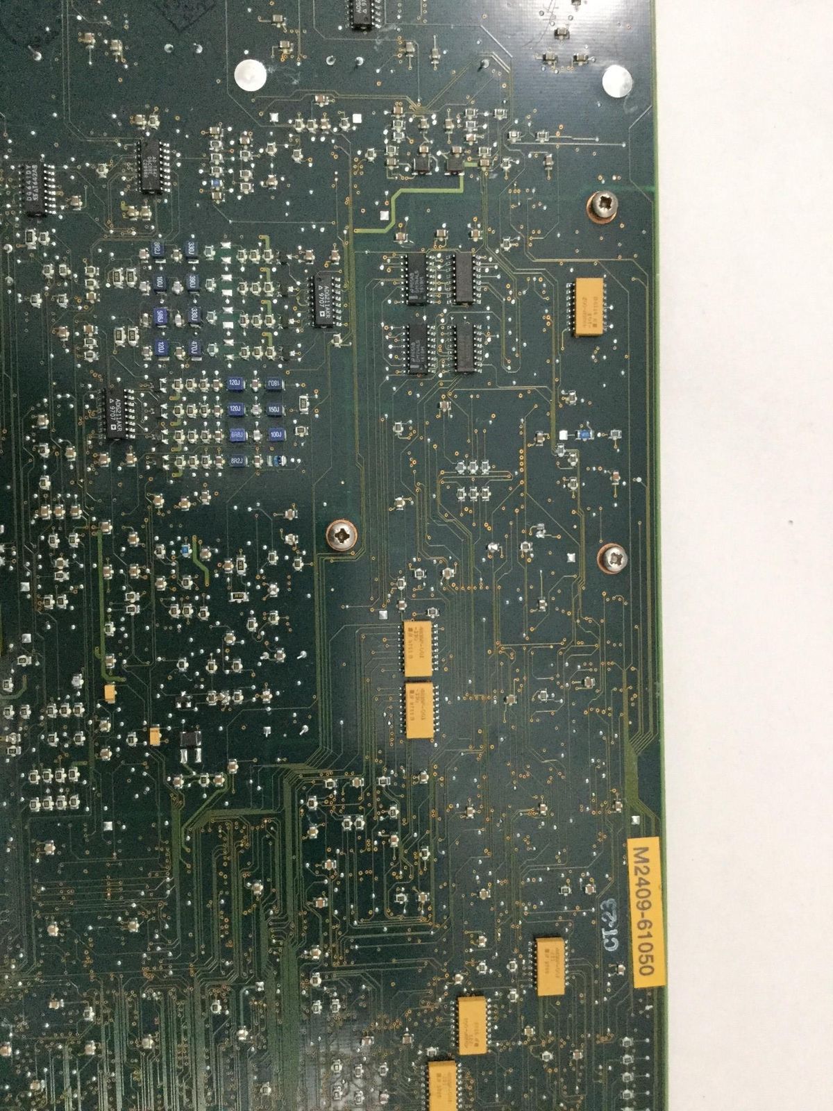 a close up of a circuit board with many small holes in it