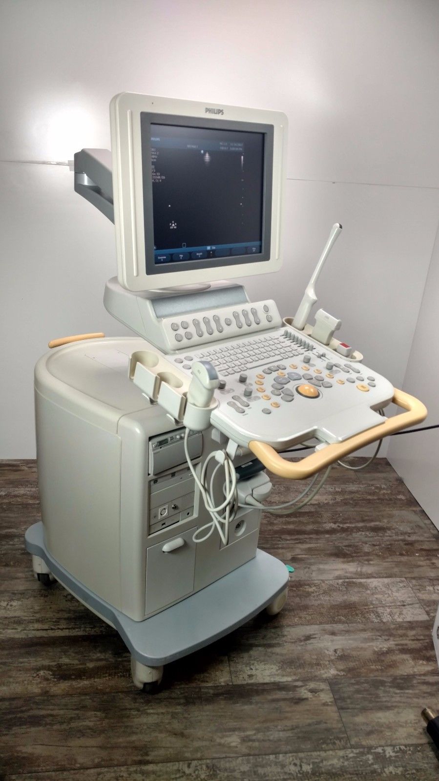 a laptop computer sitting on top of a medical cart