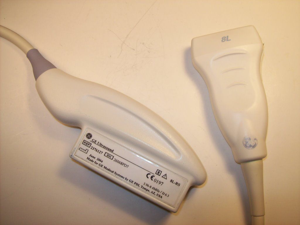 a close up of a probe with yellow background